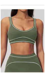 Detail of smoky moss green U-neck sports bra with contrast white stripes and dual straps