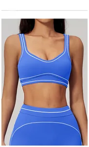 Detail of Ink Blue sports bra with U-shaped neckline and double white stripe trim