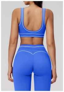 Detail view of Klein blue yoga set featuring contrast stitching and heart-shaped booty lift