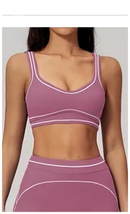 Detail of fig purple yoga set showing u-shaped back and contrast stitching on the sports bra