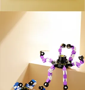 Mechanical fidget spinner with deformable purple and blue joints and suction cup feet