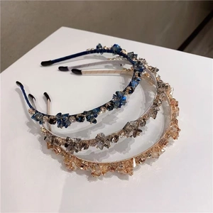 Detail of luxury crystal beaded headbands in blue, silver grey and champagne gold colors
