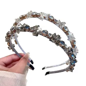 Elegant crystal headband with sparkling rhinestones on a slim metal frame for women