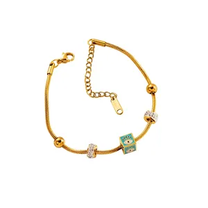 Bracelet serpent en acier inoxydable doré avec pendentif œil bleu et perles cristal