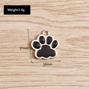 Macro shot showing dimensions of black cat paw alloy charm pendant with 1.4g weight