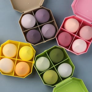 Detail of multi-color beauty sponge set with waterdrop and slanted shapes in 4-grid box