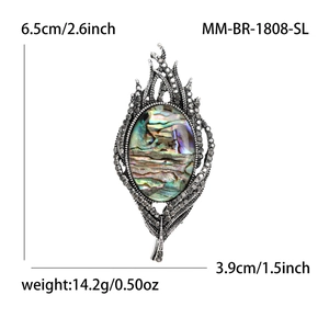 Vintage feather brooch with natural abalone shell inlay and grey rhinestones