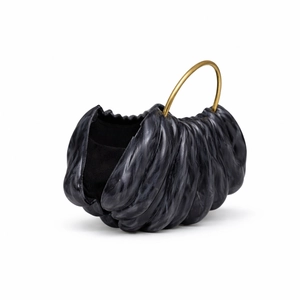 Detail of grey marble acrylic evening clutch featuring wave texture and gold metal ring handle