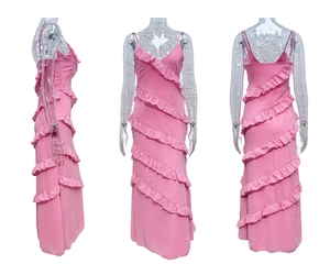 Detail of pink backless slip dress featuring six-tier diagonal ruffled layers and side slit