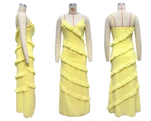Detail view of yellow V-neck backless maxi dress with multi-layered ruffle trim