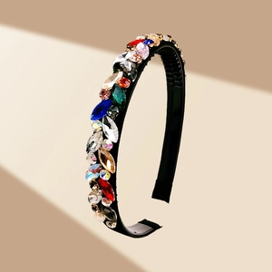 Detailed view of colorful rhinestones on a non-slip black headband with small teeth