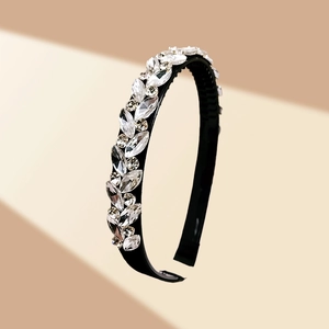 Close-up of sparkling crystal headband with marquise rhinestones and non-slip teeth