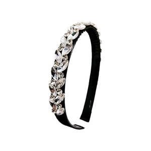 Elegant black headband with sparkling crystal floral pattern on a clean white backdrop