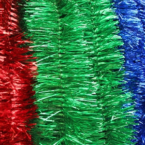 Detail of 2m metallic Christmas tinsel in red, green, and blue for festive tree decoration