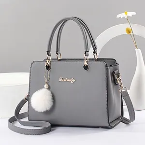 Elegant grey large capacity handbag with plush charm and detachable crossbody strap