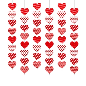 Red and white heart-shaped party garlands with dots and stripes for Valentine decor