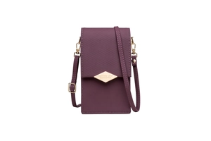 Macro detail of purple rhombus quilted flap and golden metal hardware on crossbody bag