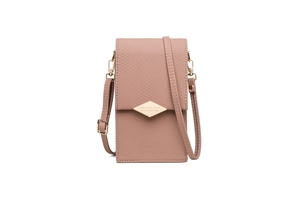 Close-up of pink crossbody bag featuring quilted flap and gold diamond-shaped hardware