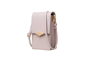 Detail of pink crossbody phone bag with diamond quilted texture and gold logo plate