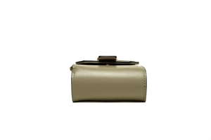 Detail view of olive green leather crossbody bag with golden buckle and black edges