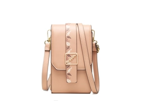 Detail of pink crossbody phone bag with leaf print strap and golden metal buckle