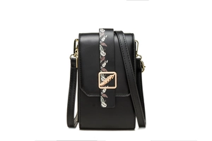 Close-up of black PU leather bag featuring a gold feather buckle and leaf pattern strap
