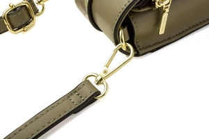 Macro detail of dark green leather bag with golden adjustable strap buckle and lobster clasp