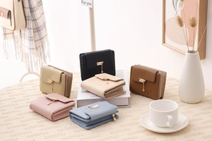 Selection of colorful faux leather wallets with heart tassels and zipper pockets