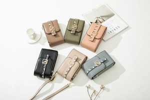 Detailed close-up of six vertical PU leather phone bags with gold leaf clasps in various colors