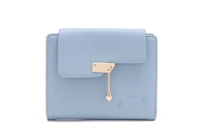 Detailed view of light blue tri-fold wallet with heart-shaped pendant and embroidery