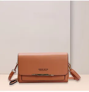 Detail of khaki multifunctional wallet with metal bar and dual zipper compartments