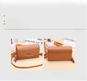 Front and back views of a brown leather crossbody wallet with gold metal bar details