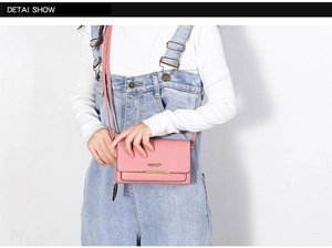 Close-up of pink PU leather wallet with metal trim and Forever Better branding