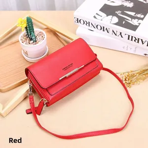 Red lychee texture faux leather crossbody bag with gold zipper and shoulder strap