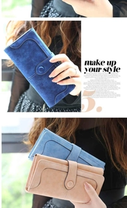 Detail of matte long wallet with snap closure and multi-card slots in blue and khaki