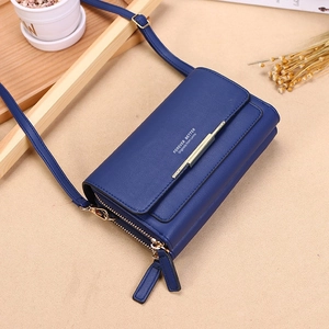 Navy blue faux leather crossbody wallet purse with gold hardware and shoulder strap