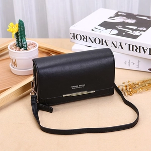 Detail of a textured black PU leather crossbody bag featuring white Forever Better lettering