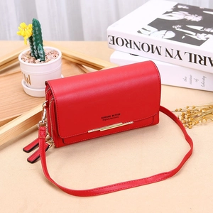 Detail of red long wallet with lychee pattern, gold metal trim and double zippers
