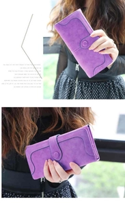 Detail of purple matte long wallet showing elegant flap closure and decorative stitching