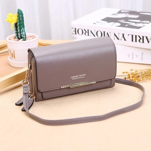 Detail of gray-purple leather crossbody wallet with dual zippers and gold metal bar accent
