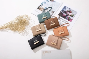 Detailed arrangement of six colorful PU leather wallets with floral embroidery and wrist straps