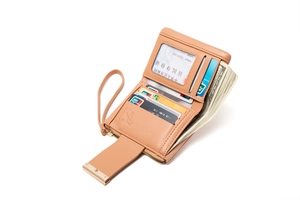 Internal detail of a light brown multi-slot PU leather wallet with card slots and wrist strap