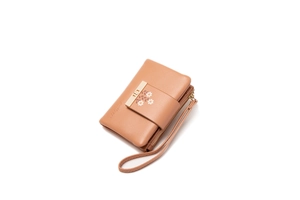 Detail of light brown lychee grain leather wallet with floral print and metal buckle