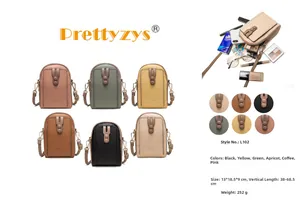 Detailed view of women's leather phone bag with zip pockets and adjustable strap details