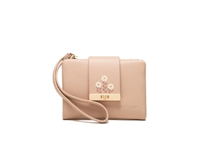 Close-up of pink PU leather wristlet wallet featuring floral prints and metal clasp