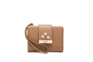 Close-up of brown PU leather wallet featuring white daisy prints and a gold clasp