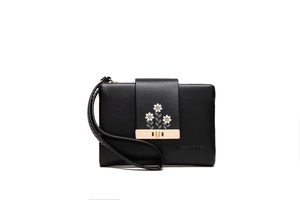 Detail of black pebbled leather clutch featuring white daisy embroidery and gold lock