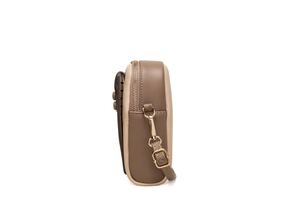 Side view of two-tone crossbody phone bag with gold zipper and adjustable strap