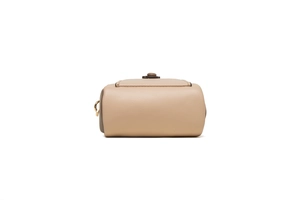 Detail of nude leather phone bag showing lychee grain texture and gold hardware