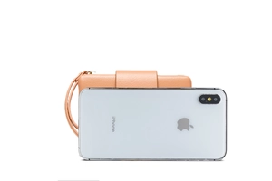 Litchi pattern PU leather clutch with wristlet shown next to a smartphone for size reference